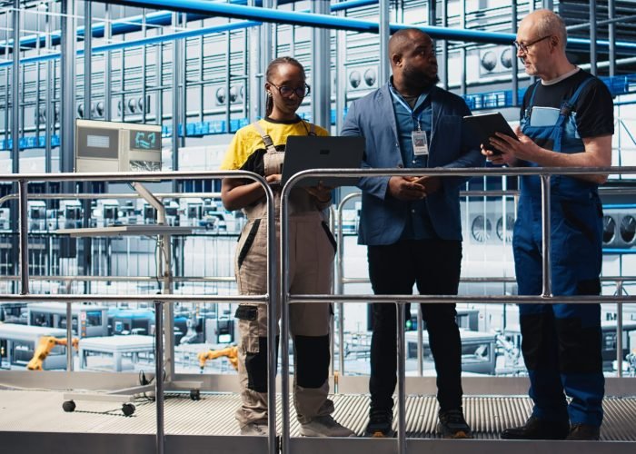 industry 4.0 photovoltaics plant manager overseeing work done by employees